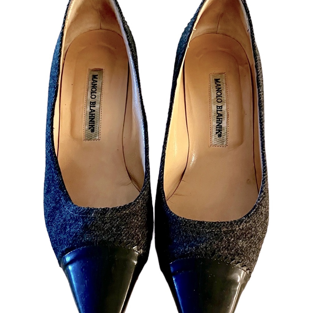 A pre-owned pair of low heels.  Outer is a gray wool with black leather.